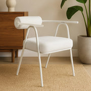 Elegant white dining chair featuring a minimalist frame and a polished finish.